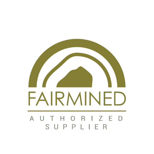 Logotipo Fairmined verde oliva con un arco estilizado sobre una montaña, FAIRMINED en negrita y PROVEEDOR AUTORIZADO en texto más pequeño debajo sobre fondo claro.