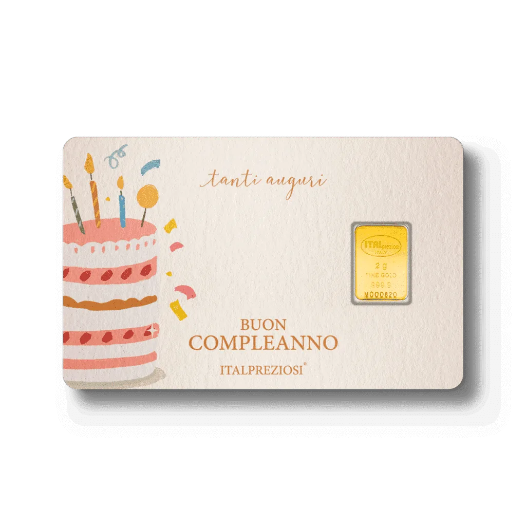 Compleanno: un biglietto di compleanno con una torta illustrata, candeline, coriandoli vivaci, le frasi "tanti auguri" e "Buon Compleanno" e un piccolo lingotto d'oro incastonato sul lato destro.