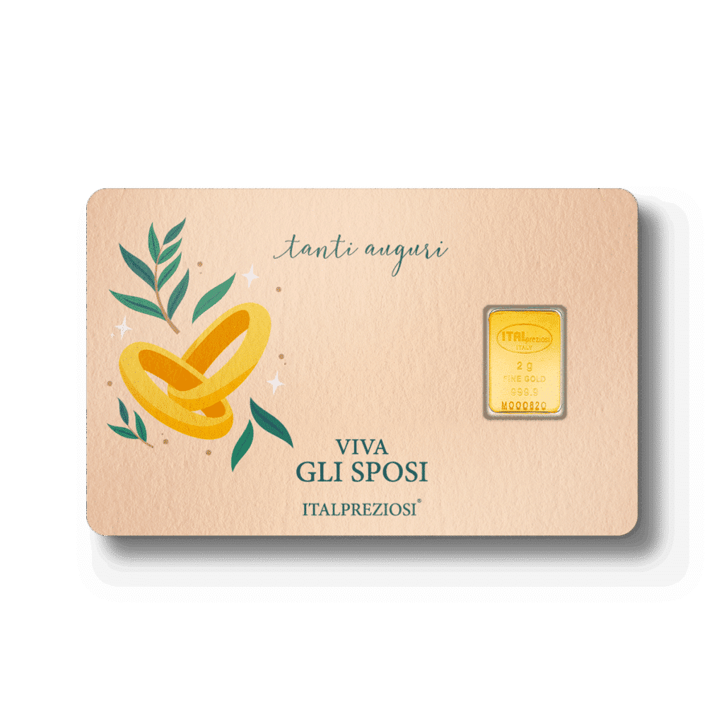 Biglietto matrimoniale con fedi d'oro, foglie verdi e frasi italiane "Tanti auguri" e "Viva gli sposi", con un lingotto d'oro 999,9 Italpreziosi da 2,5 g incastonato sulla destra.