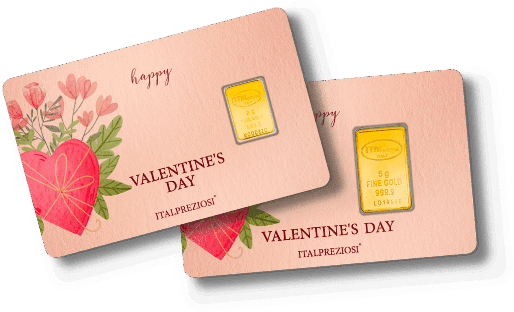 Two 5g FINE GOLD 999.9 bars in rectangular cases, each on a pink card with floral and heart designs. Cards read “Happy Valentine’s Day” and “ITALPREZIOSI.” Product name: Valentine’s Day.
