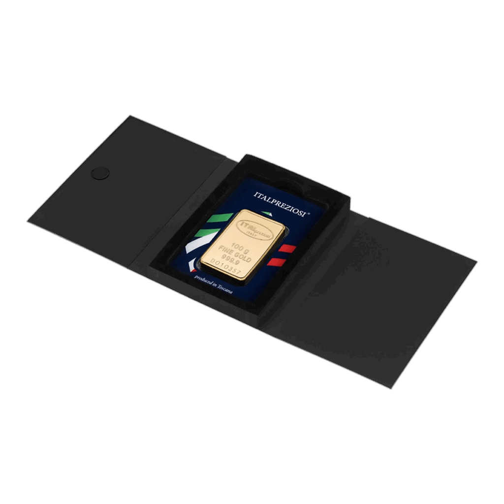 Il Lingotto Oro 100gr è presentato in un astuccio nero aperto con dietro un cartoncino a righe tricolori e la scritta "ITALPREZIOSI" visibile sul cartoncino.