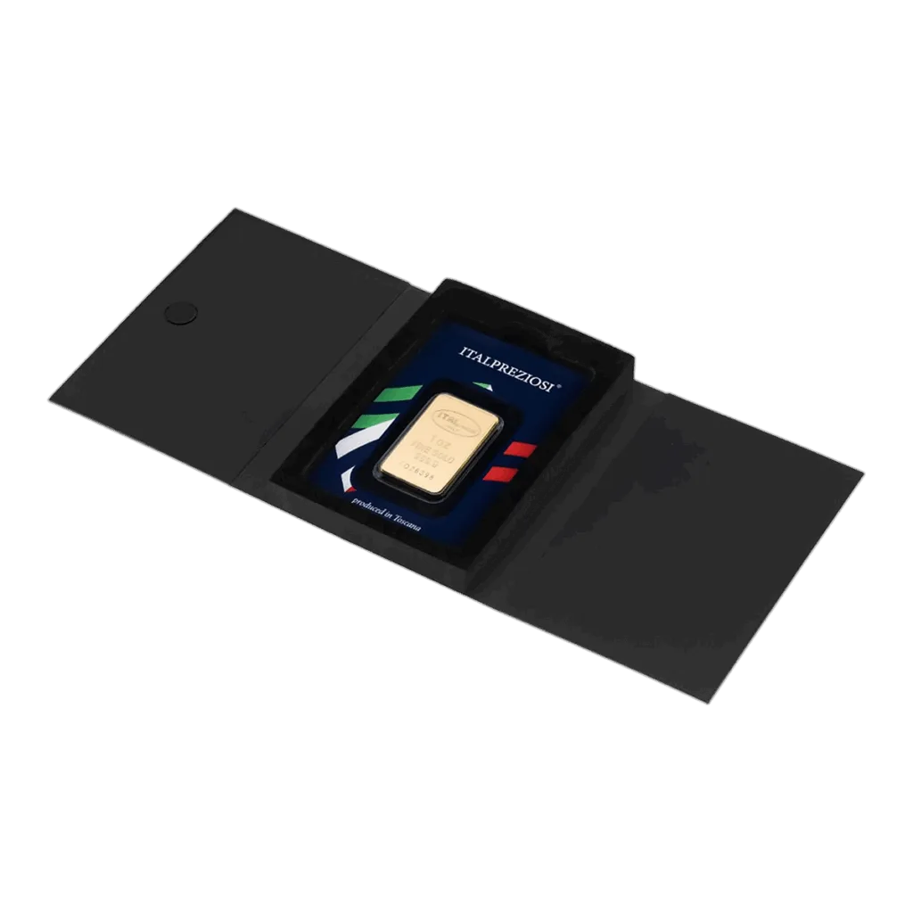 Il Lingotto Oro 1 oncia è sigillato in una custodia protettiva con i colori della bandiera italiana e la scritta "ITALPREZIOSI", esposta all'interno di una cartella nera aperta con chiusura magnetica.