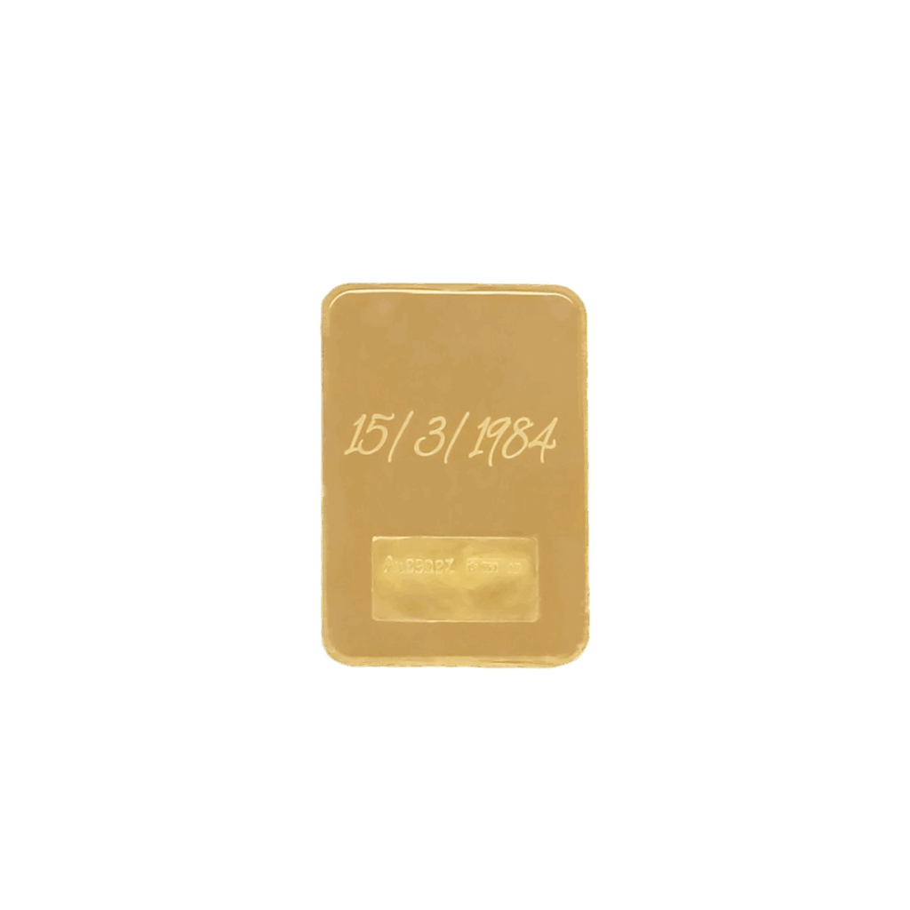 Un lingotto d'oro da 2gr, datato 15/3/1984, è centrato su uno sfondo bianco.