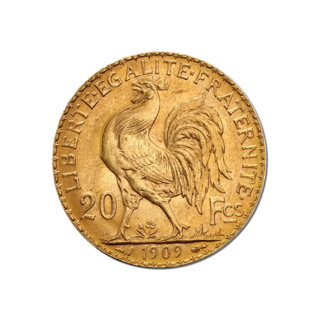 La moneda de oro de 20 Francos Franceses Gallo y Mariana Oro 1899-1914 muestra un gallo central con la inscripción "LIBERTE EGALITE FRATERNITE", marcada 20 Fcs y fechada en 1909 en la parte inferior.