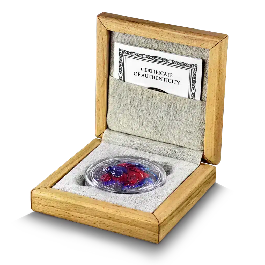 The Niue Island 2024 Betta Fish 2 oz Silver High Relief coin, housed in a wooden display box with a fabric-lined interior and clear case, includes a certificate of authenticity propped behind the coin.