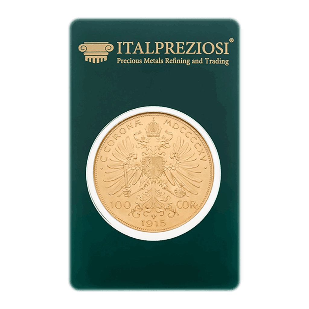 Una moneta d'oro da 100 corone d'Austria, segnata 1915, con il disegno dell'aquila bicipite, è sigillata in un cartoncino verde Italpreziosi con la dicitura Raffinazione e commercio di metalli preziosi.