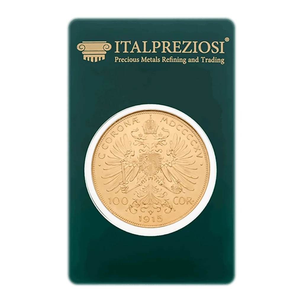 Una moneta d'oro da 100 corone d'Austria, segnata 1915, con il disegno dell'aquila bicipite, è sigillata in un cartoncino verde Italpreziosi con la dicitura Raffinazione e commercio di metalli preziosi.
