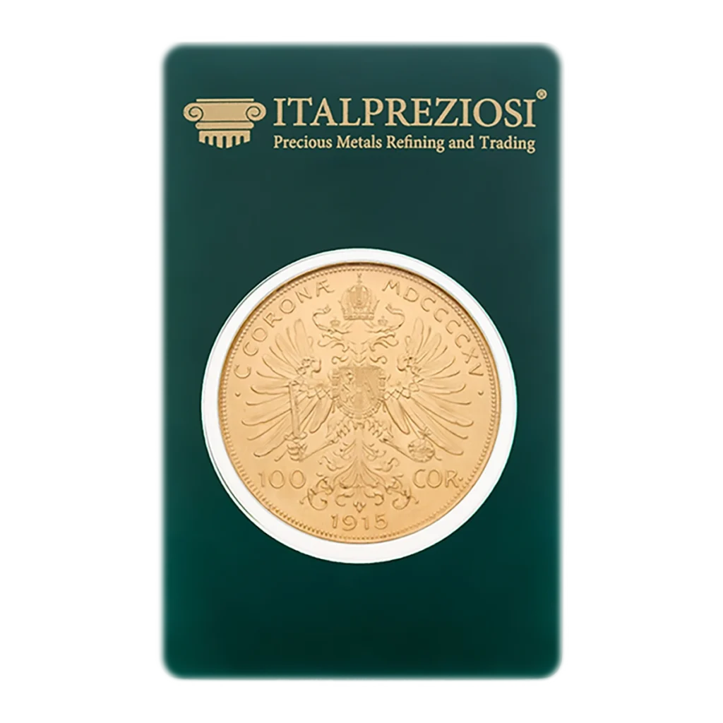 Moneda de oro de Austria de 100 coronas con un diseño de águila bicéfala y el año 1915, presentada en un embalaje verde de Italpreziosi con la etiqueta "Precious Metals Refining and Trading".