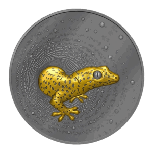 La moneta d'argento Camerun 2023 Geco 2 oz Argento Dorato Scuro UHR mostra un geco color oro in rilievo con macchie nere che si insinuano attraverso un motivo circolare concentrico e strutturato.