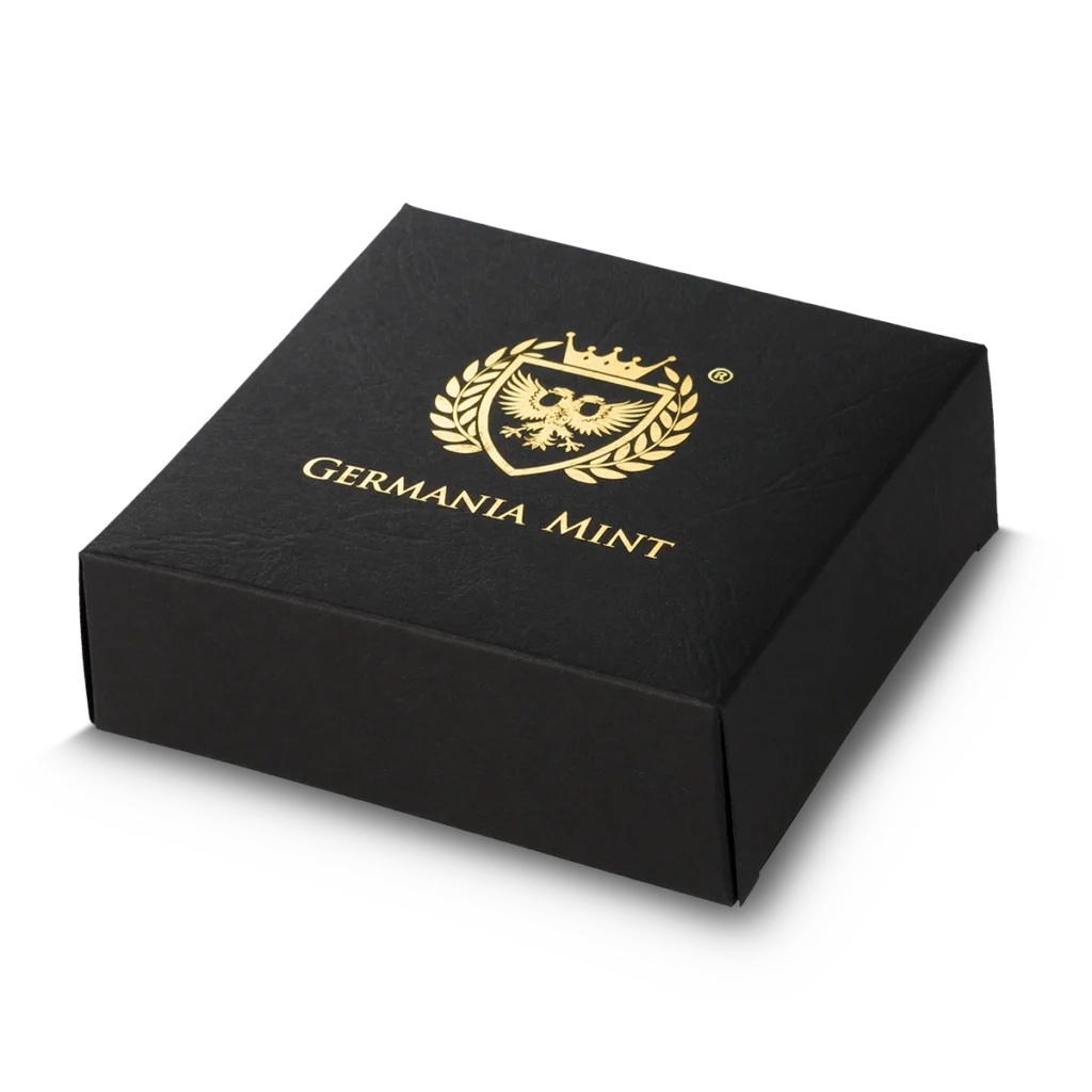 Una caja cuadrada negra con escudo dorado y diseño de laurel, rotulada GERMANIA MINT en la tapa, alberga el Prime Bullion - 2024 Malta Golden Eagle 5 Euro 1 oz Plata BU Edición Limitada.