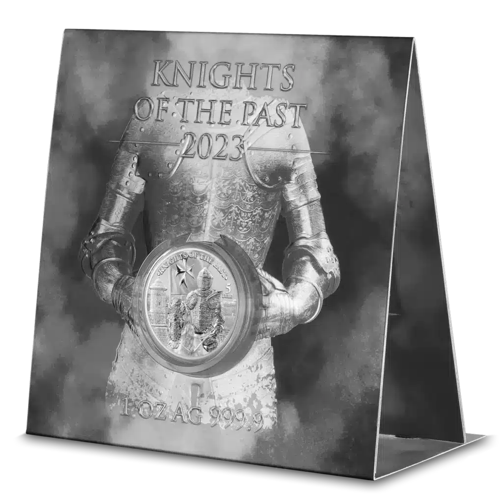 A display shows a medieval knight in armor holding a large coin, with "2023 Knights of the Past 5 Euro 1 oz Silver BU" and "AG 999.9" text, set against a smoky, dark background.