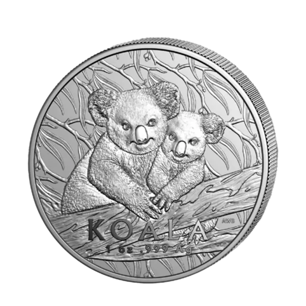 La moneda de 1 oz Koala Australiano Plata 2025 muestra dos koalas sentados en la rama de un árbol con hojas de fondo, y lleva la inscripción "KOALA" y "1 oz 999 Ag" en la parte inferior.
