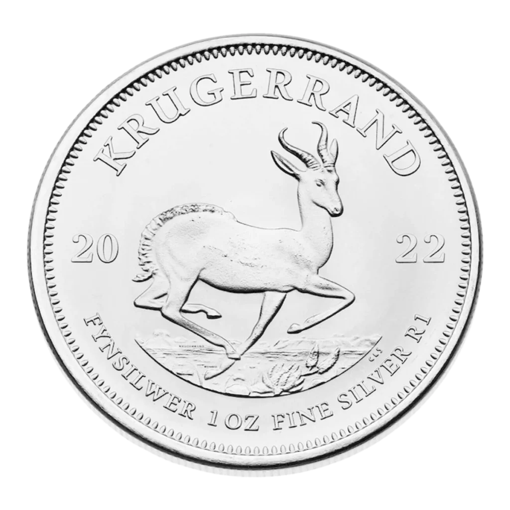 Una moneda de Krugerrand de plata de 2022 muestra un antílope springbok en su centro, rodeado por las inscripciones KRUGERRAND y FINE SILVER 1 OZ FINE SILVER R1 a lo largo del borde.