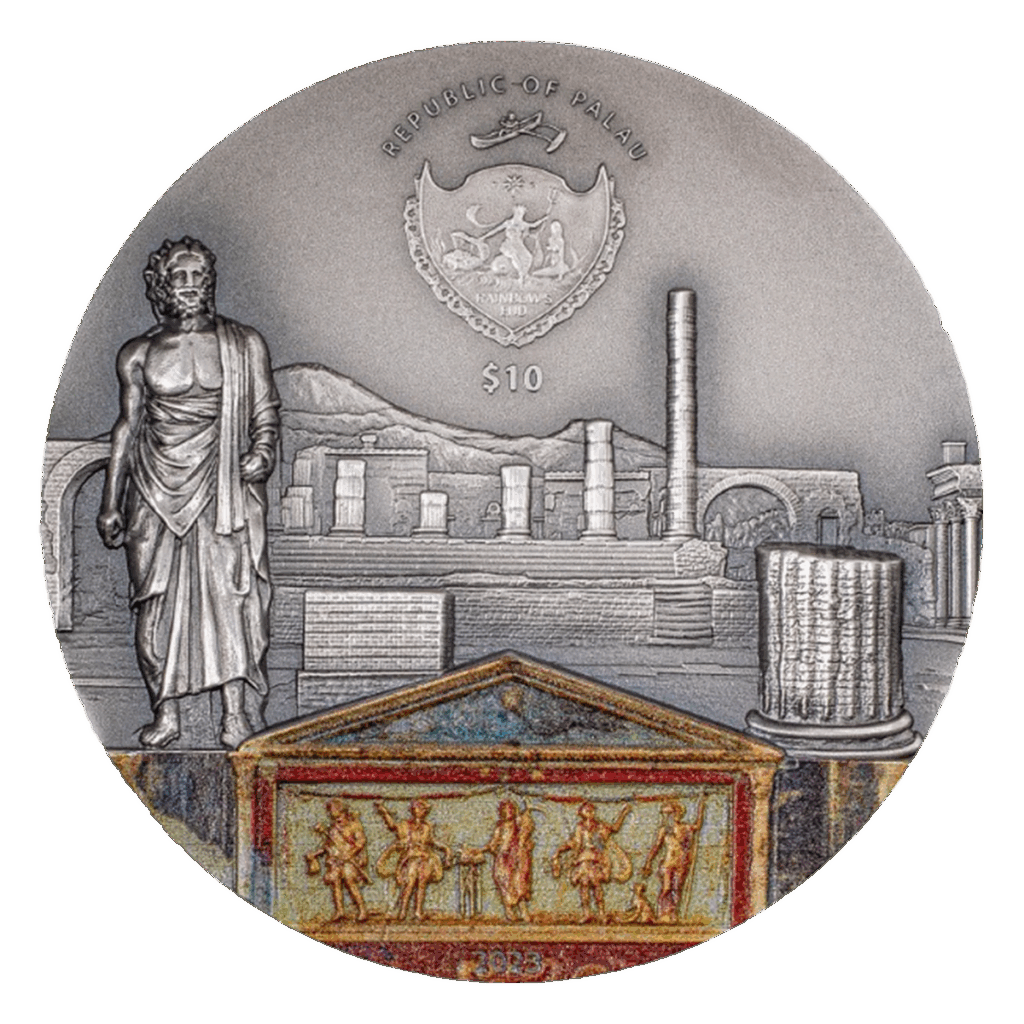 La moneta d'argento Palau 2023 Eruzione del Vulcano Pompei da 2 once mostra antiche rovine romane, una statua di un uomo vestito, una colonna e un fregio. La parte superiore mostra lo stemma di Palau, la scritta "Republic of Palau" e la denominazione 10.