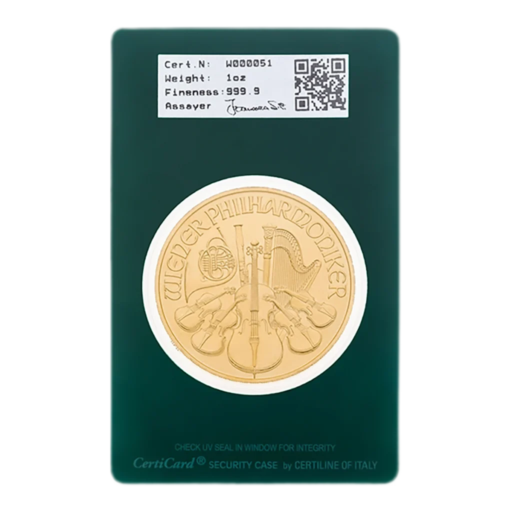 La Filarmónica de Viena es una moneda de oro de 1 onza con diseños de instrumentos musicales y el texto "WIENER PHILHARMONIKER", presentada en una tarjeta verde de certificado en la que figuran el número de serie, el peso y la ley.