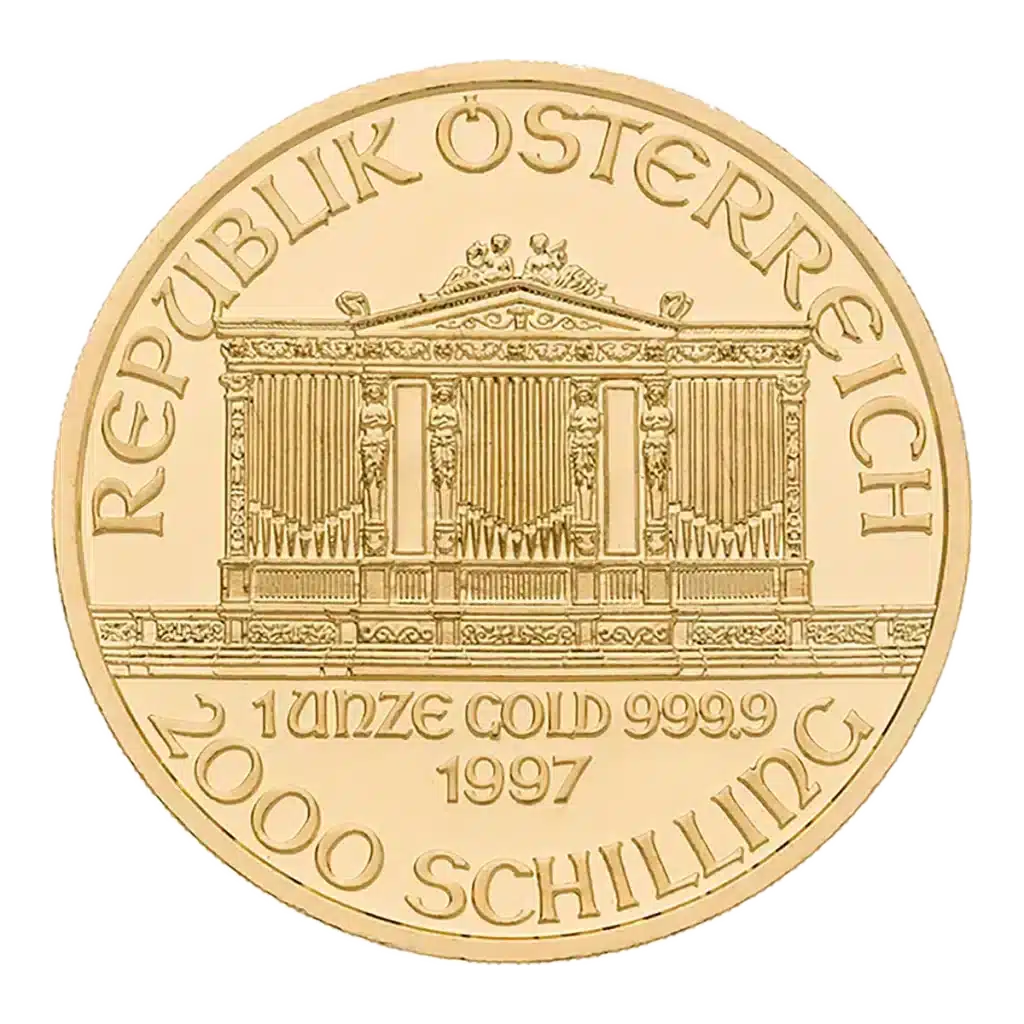 La moneda de oro de la Filarmónica de Viena muestra la inscripción "REPUBLIK ÖSTERREICH" sobre un edificio ornamentado, con la inscripción "1 UNZE GOLD 999.9 1997" y la denominación "2000 SCHILLING" debajo.