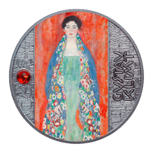 La moneda "Retrato de la Señorita Lieser - Gustav Klimt 500 Francos CFA" muestra un colorido retrato de una mujer con vestido verde y un vibrante chal floral sobre fondo rojo, además de GUSTAV KLIMT y una gema roja a la izquierda.