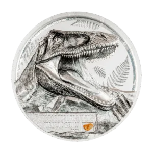 Fronte della moneta da collezione "Jurassic Relics – Carcharodontosaurus" Italpreziosi in argento con incisione ad alto rilievo raffigurante la testa del Carcharodontosaurus a fauci aperte, con felci preistoriche sullo sfondo. In basso, targa con nome della specie. Anno 2026 inciso sul bordo inferiore.