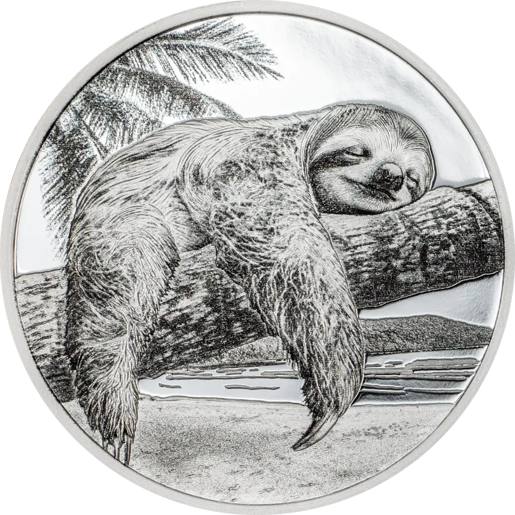 La moneta Seven Deadly Sins - Accidia da 1 oz in argento 999.9 proof mostra un bradipo addormentato e sorridente aggrappato al ramo di una palma, con la spiaggia e il mare sullo sfondo, resa con colorazione nera su fondo argento a specchio.