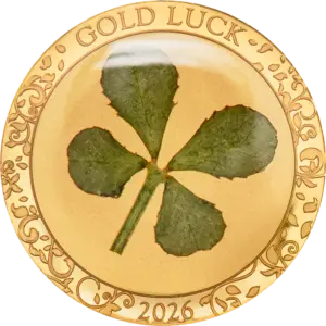 La moneta Gold Luck 2026 da 1 g in oro 999.9 proof racchiude un vero quadrifoglio verde sotto la superficie, incorniciato da decori floreali incisi e dalle scritte GOLD LUCK e 2026.
