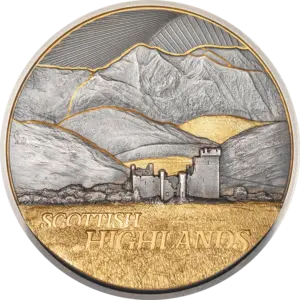 La moneta Golden Landscapes - Scottish Highlands da 2 oz in argento 999.9 con finitura anticata mostra in ultra alto rilievo un castello in rovina ai piedi delle montagne scozzesi, con brughiera e profili delle vette in doratura parziale e la scritta SCOTTISH HIGHLANDS.