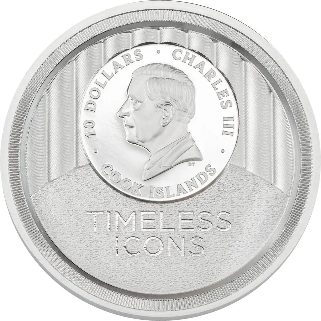 Dritto della moneta Timeless Icons - Statua della Liberta 2 oz argento: medaglione con l'effigie di re Carlo III e le scritte 10 DOLLARS, CHARLES III, COOK ISLANDS, su fondo a scanalature verticali con la dicitura TIMELESS ICONS in rilievo.