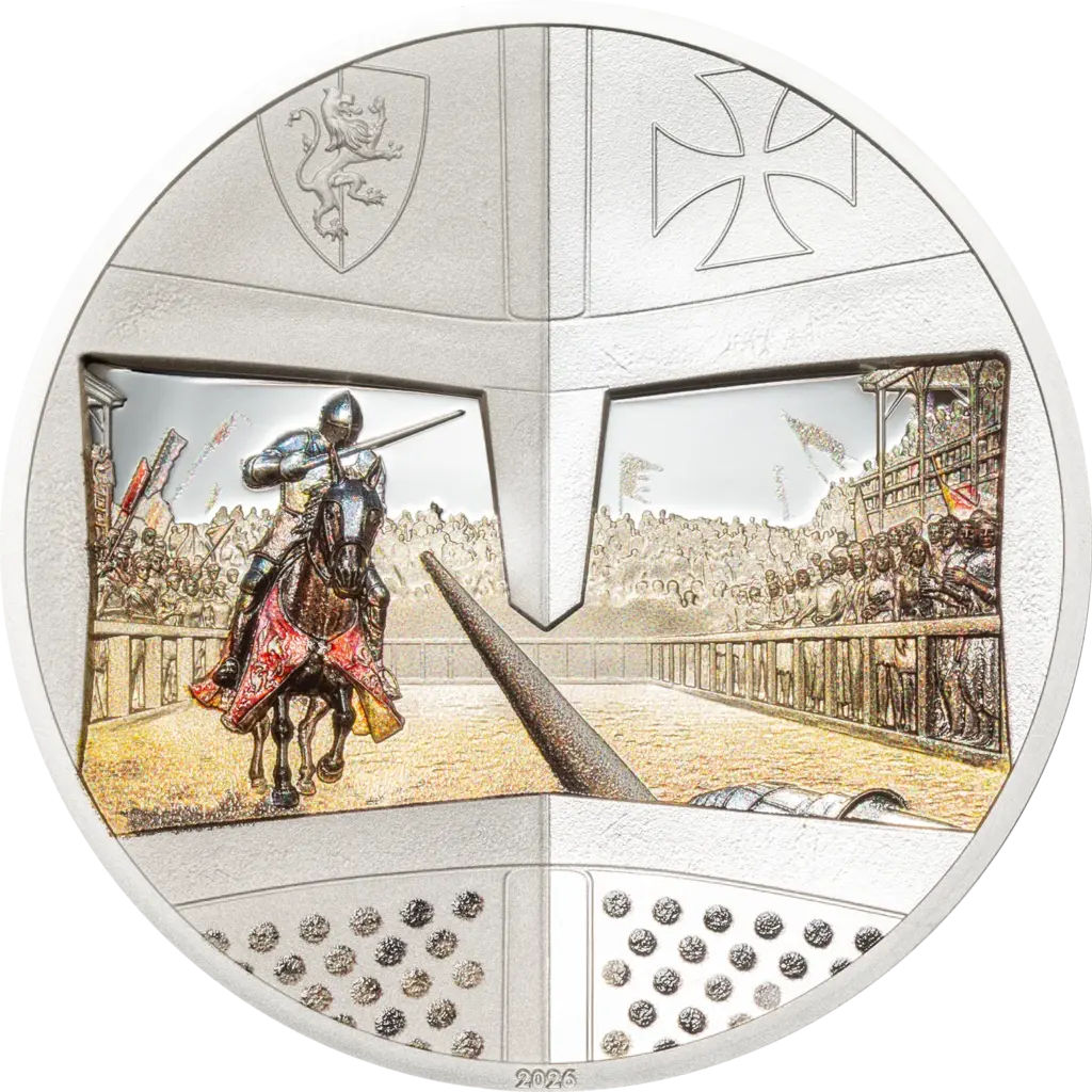 La moneta Knight Games - Giostra da 1 oz in argento 999,9 proof mostra una giostra vista dalle fessure di una visiera: un cavaliere a colori che carica con la lancia davanti alla tribuna, lo scudo con il leone rampante e una croce in alto e la data 2026.