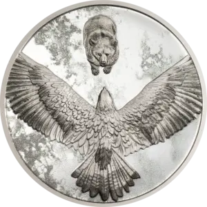 La moneta Seven Deadly Sins - Invidia da 1 oz in argento 999,9 proof mostra, in toni di grigio, un'aquila ad ali spiegate al centro e, nella parte alta, un orso che la fissa.
